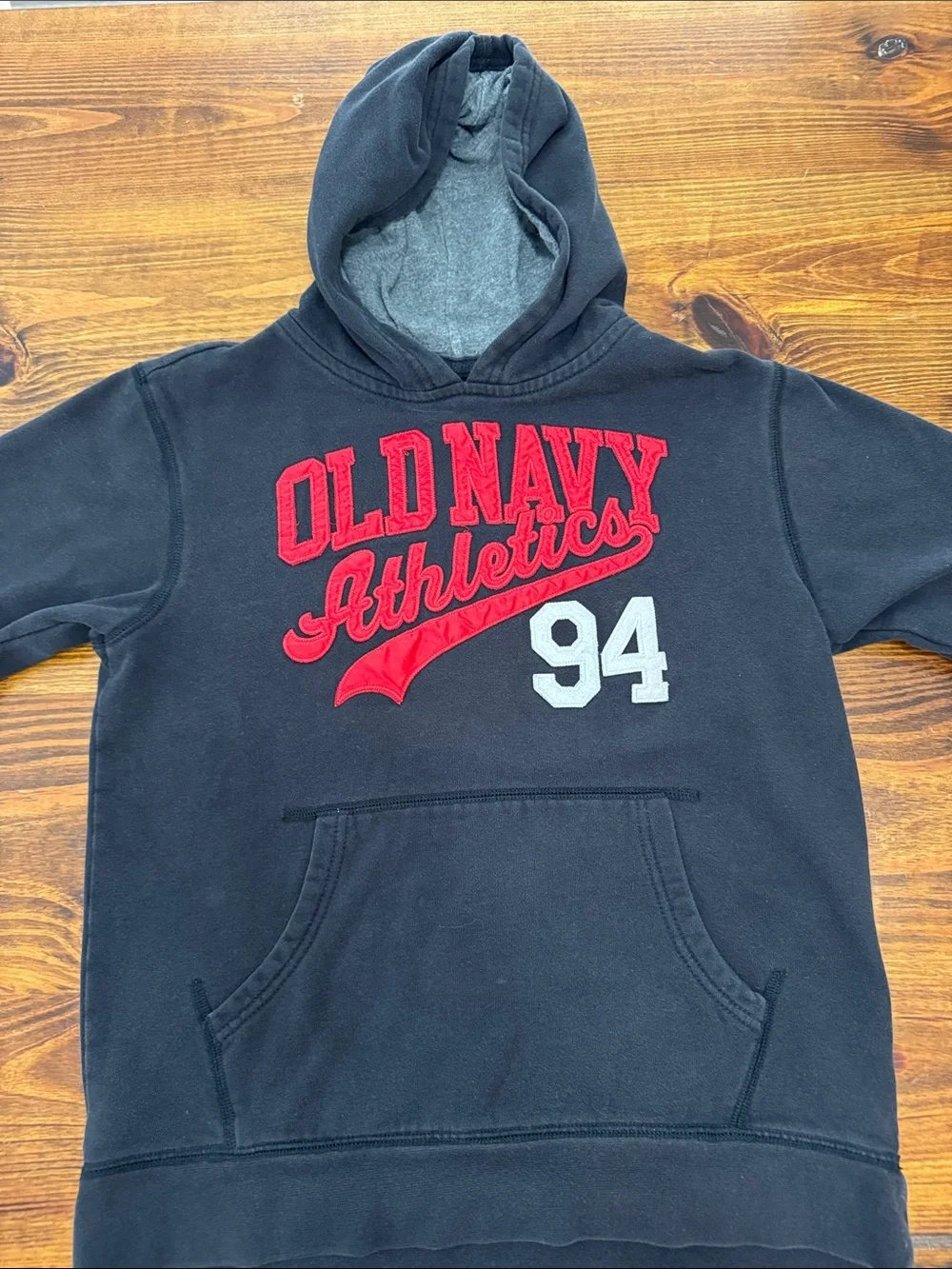 Kids Old Navy Black Hoodie with Red Applique and White 94. Size large (10/12)